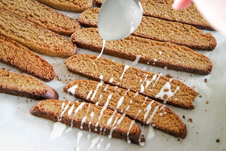 Drizzling Glaze on Gingerbread Biscotti